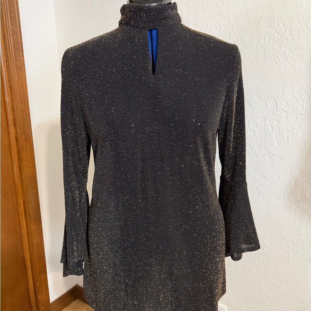 Black with gold threads for evening or party woman’s size medium never worn